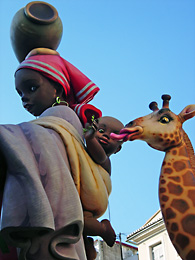 black woman, baby and giraffe