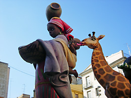 black woman, baby and giraffe