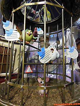 cage with birds making tweets